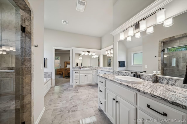 20905 S Windsor Ave, Claremore, OK 74019 - full bathroom with a shower stall, two vanities, a bath, and marble finish flooring