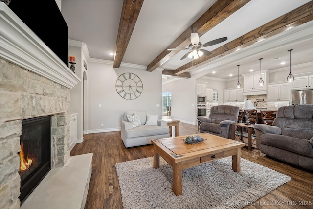 20905 S Windsor Ave, Claremore, OK 74019 - living area featuring a stone fireplace, a ceiling fan, dark wood-style floors, recessed lighting, and crown molding