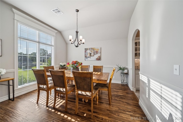 20905 S Windsor Ave, Claremore, OK 74019 - dining space with healthy amount of natural light, a chandelier, dark wood finished floors, and vaulted ceiling