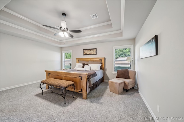 20905 S Windsor Ave, Claremore, OK 74019 - bedroom featuring a raised ceiling, multiple windows, carpet, and ornamental molding