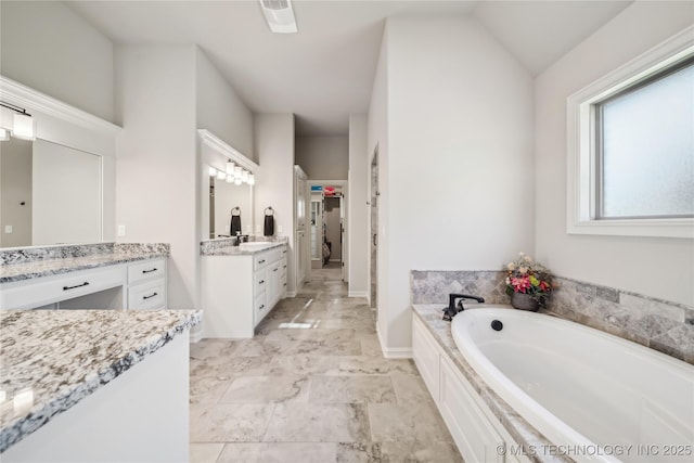 20905 S Windsor Ave, Claremore, OK 74019 - full bath with a garden tub, two vanities, and marble finish flooring
