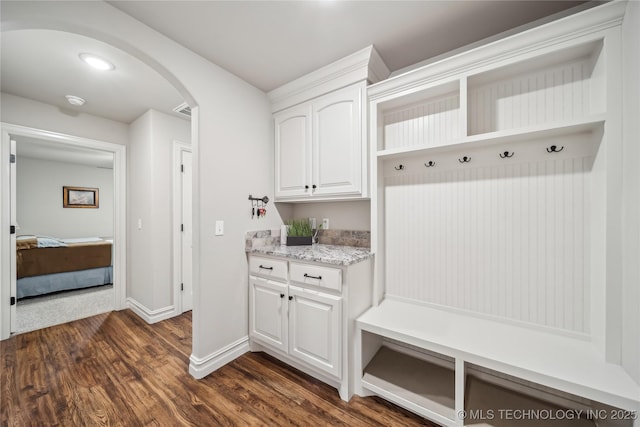 20905 S Windsor Ave, Claremore, OK 74019 - mudroom with arched walkways and dark wood-type flooring