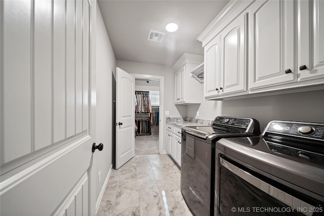 20905 S Windsor Ave, Claremore, OK 74019 - laundry area with washing machine and clothes dryer, cabinet space, and light marble finish flooring