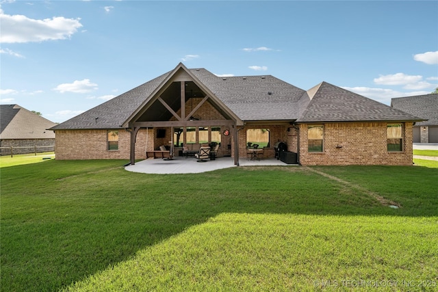 20905 S Windsor Ave, Claremore, OK 74019 - back of house with a patio area, a yard, roof with shingles, an outdoor hangout area, and brick siding