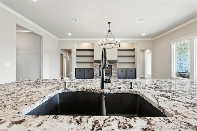 14109 N 72nd E Ave, Collinsville, OK 74021 - kitchen featuring open shelves, light stone counters, crown molding, recessed lighting, and pendant lighting