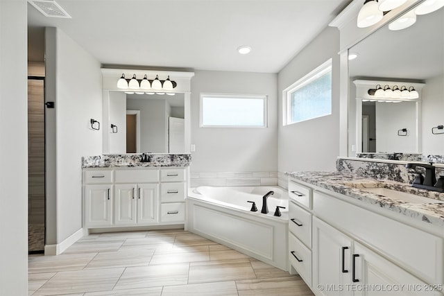14109 N 72nd E Ave, Collinsville, OK 74021 - bathroom with two vanities and a bath