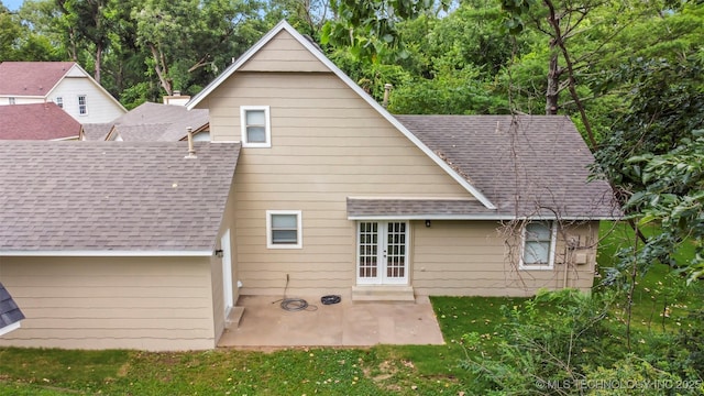 2003 Charlestown Cir, Claremore, OK 74017 - back of property with roof with shingles, french doors, a patio, and a yard