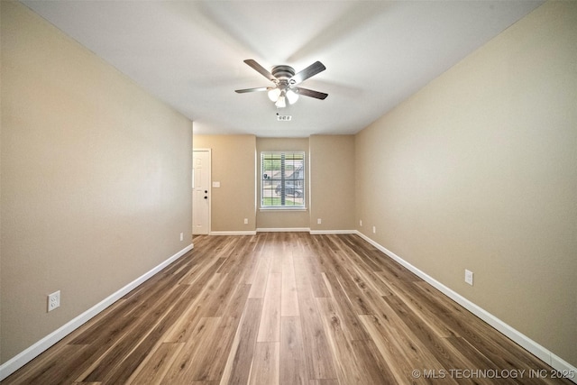 2003 Charlestown Cir, Claremore, OK 74017 - empty room with a ceiling fan and wood finished floors