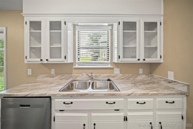 2003 Charlestown Cir, Claremore, OK 74017 - kitchen with dishwasher, white cabinetry, and glass insert cabinets