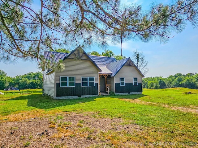 5068 E 188th St S, Warner, OK 74469 - view of front of house with a front yard and a metal roof