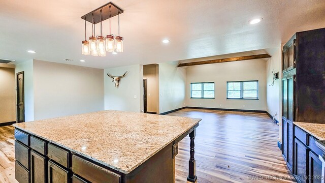 5068 E 188th St S, Warner, OK 74469 - kitchen with light wood finished floors, a center island, hanging light fixtures, recessed lighting, and light stone counters