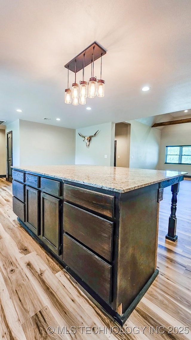 5068 E 188th St S, Warner, OK 74469 - kitchen with light wood finished floors, a center island, light stone countertops, recessed lighting, and pendant lighting