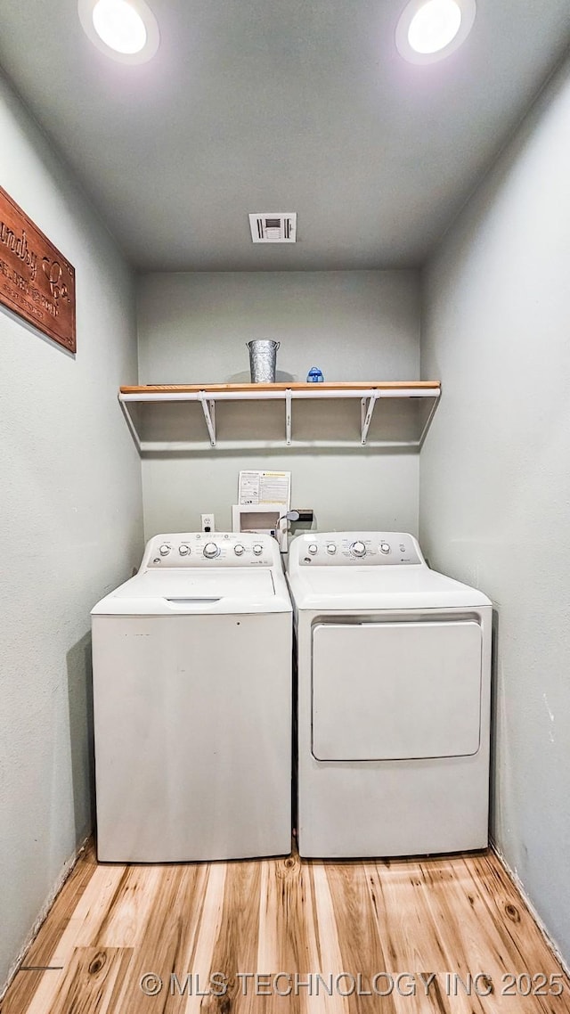 5068 E 188th St S, Warner, OK 74469 - laundry room with separate washer and dryer and wood finished floors