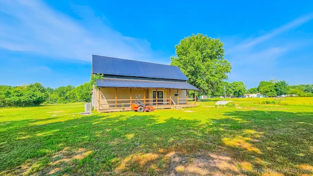 5068 E 188th St S, Warner, OK 74469 - rear view of house featuring a yard and a metal roof