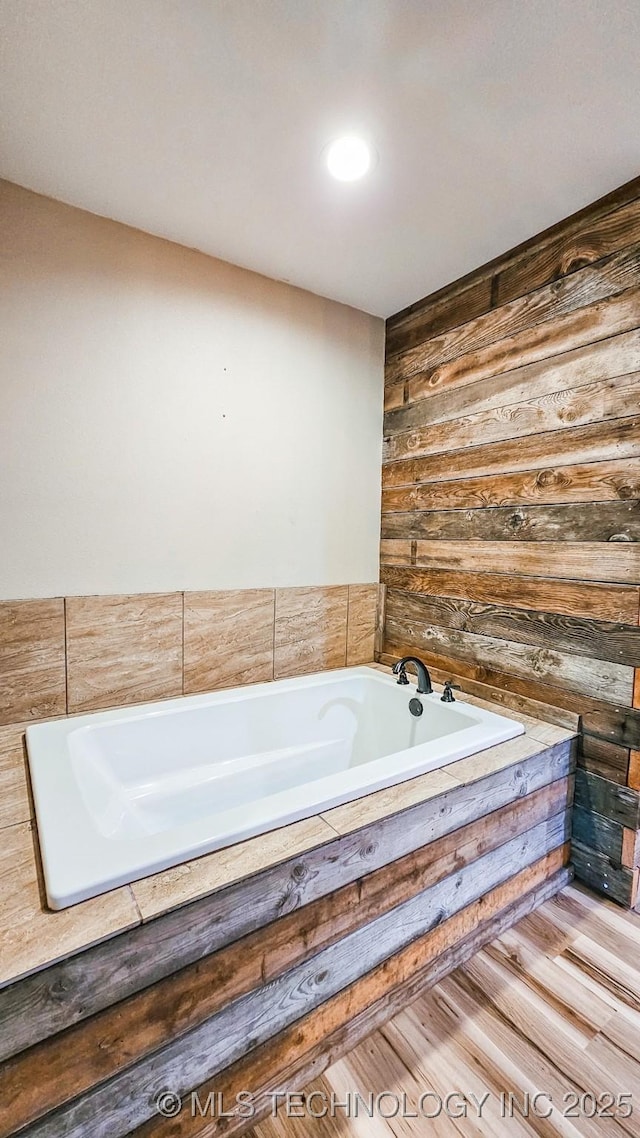 5068 E 188th St S, Warner, OK 74469 - bathroom with a bath and wood finished floors