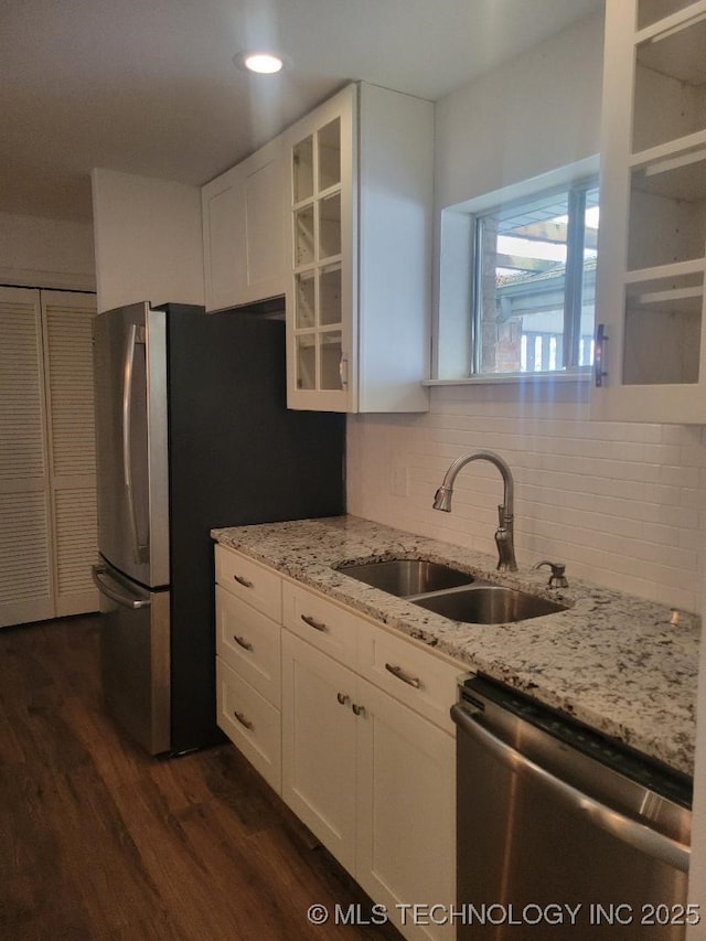 1604 S 5th St, Mcalester, OK 74501 - kitchen with stainless steel appliances, white cabinets, dark wood-type flooring, light stone counters, and recessed lighting
