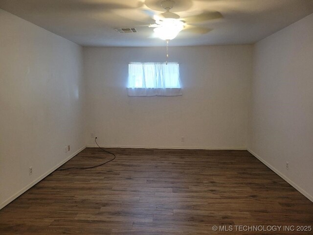 1604 S 5th St, Mcalester, OK 74501 - spare room with a ceiling fan and dark wood finished floors