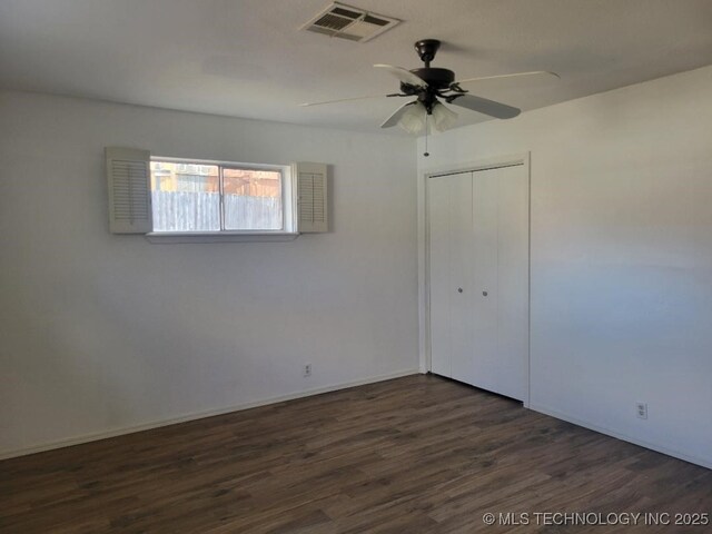 1604 S 5th St, Mcalester, OK 74501 - unfurnished room with dark wood finished floors and a ceiling fan