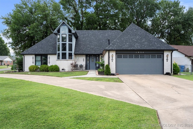 1934 Birnamwood, Miami, OK 74354 - view of front of property featuring brick siding, a front yard, roof with shingles, a garage, and concrete driveway