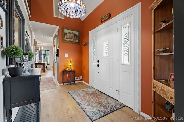 1934 Birnamwood, Miami, OK 74354 - foyer entrance featuring wood finished floors and a chandelier