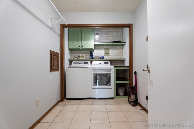 1934 Birnamwood, Miami, OK 74354 - washroom with cabinet space, washing machine and dryer, and a textured ceiling