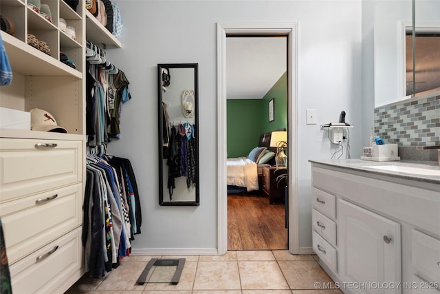 1934 Birnamwood, Miami, OK 74354 - walk in closet featuring a sink and light tile patterned floors