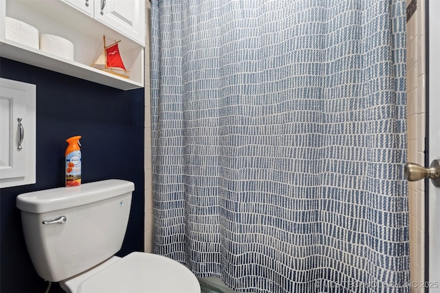 1934 Birnamwood, Miami, OK 74354 - bathroom with toilet and curtained shower