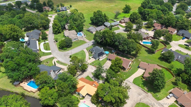 1934 Birnamwood, Miami, OK 74354 - aerial view of property's location with a pool and nearby suburban area
