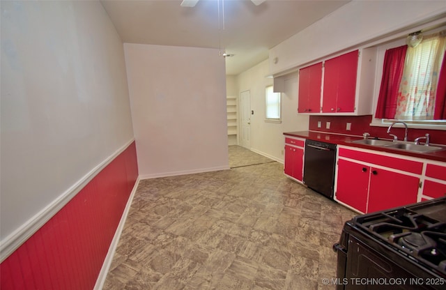 711 S 29th St W, Muskogee, OK 74401 - kitchen with red cabinets, black appliances, yellow cabinets, a ceiling fan, and wainscoting
