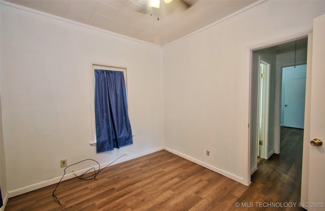 711 S 29th St W, Muskogee, OK 74401 - unfurnished room featuring dark wood-type flooring and a ceiling fan