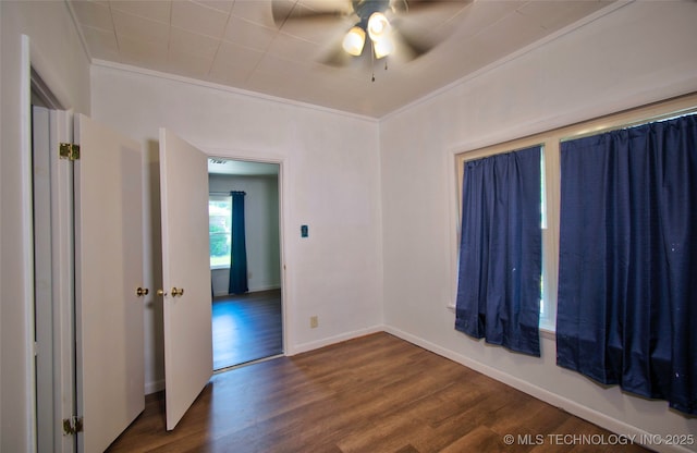 711 S 29th St W, Muskogee, OK 74401 - unfurnished room with dark wood-style flooring and a ceiling fan