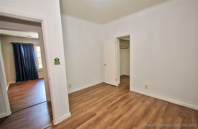 711 S 29th St W, Muskogee, OK 74401 - empty room featuring wood finished floors and crown molding