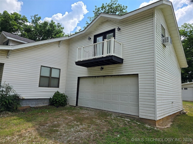 617 N 11th St, Pawnee, OK 74058 - back of property featuring a balcony, an attached garage, and cooling unit