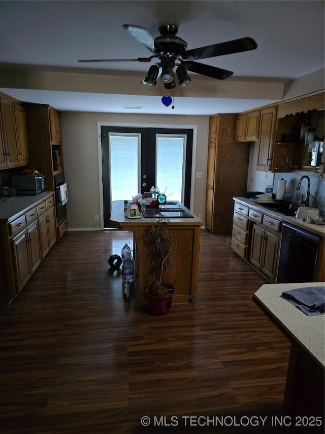 617 N 11th St, Pawnee, OK 74058 - kitchen featuring black appliances, ceiling fan, dark wood-style flooring, and light countertops