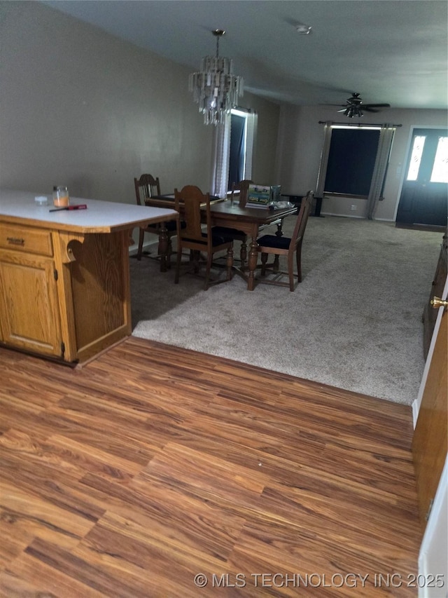617 N 11th St, Pawnee, OK 74058 - dining space featuring wood finished floors, a chandelier, and a ceiling fan