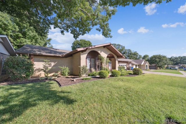 7058 E 52nd Pl, Tulsa, OK 74145 - view of front of property with brick siding, a garage, and a front lawn