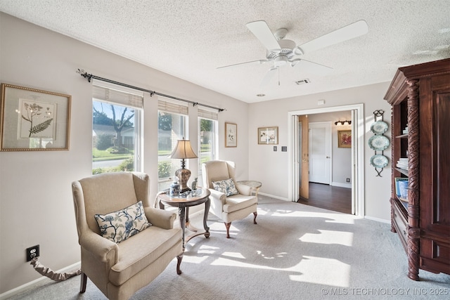 7058 E 52nd Pl, Tulsa, OK 74145 - sitting room with carpet, ceiling fan, and a textured ceiling
