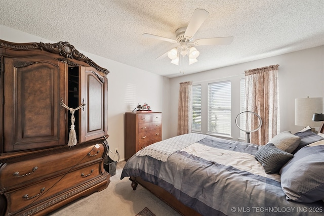 7058 E 52nd Pl, Tulsa, OK 74145 - bedroom featuring light carpet, a textured ceiling, and ceiling fan