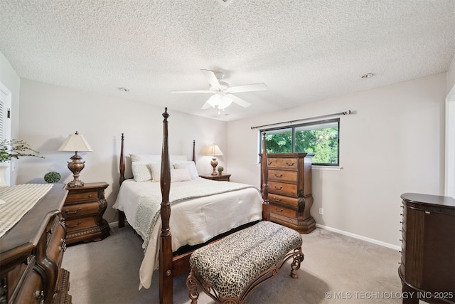 7058 E 52nd Pl, Tulsa, OK 74145 - bedroom featuring light colored carpet, a ceiling fan, and a textured ceiling