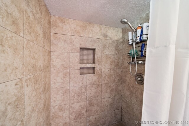 7058 E 52nd Pl, Tulsa, OK 74145 - full bathroom with a textured ceiling and tiled shower