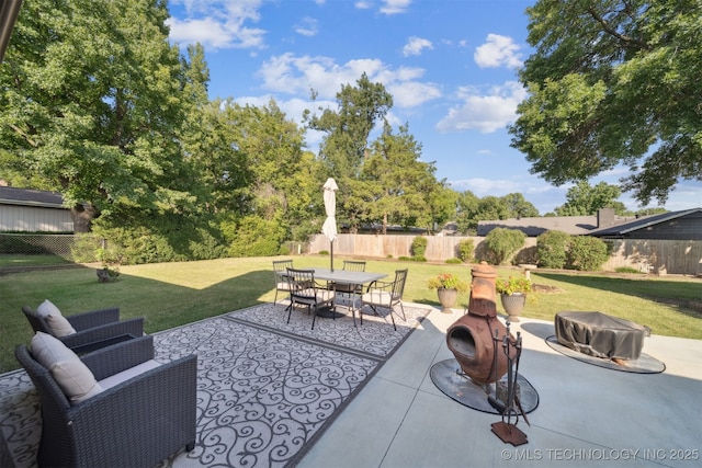 7058 E 52nd Pl, Tulsa, OK 74145 - view of patio with a fire pit