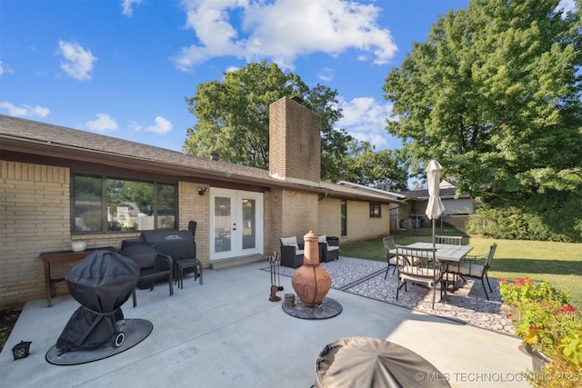 7058 E 52nd Pl, Tulsa, OK 74145 - view of patio / terrace with french doors and outdoor dining space