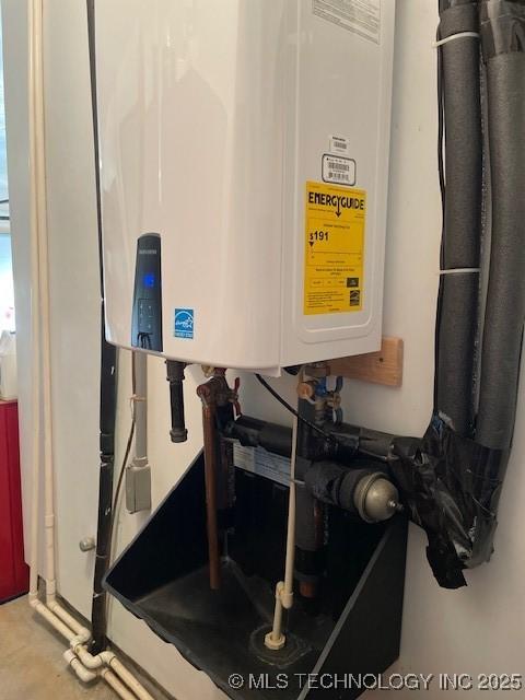 7058 E 52nd Pl, Tulsa, OK 74145 - utility room featuring water heater