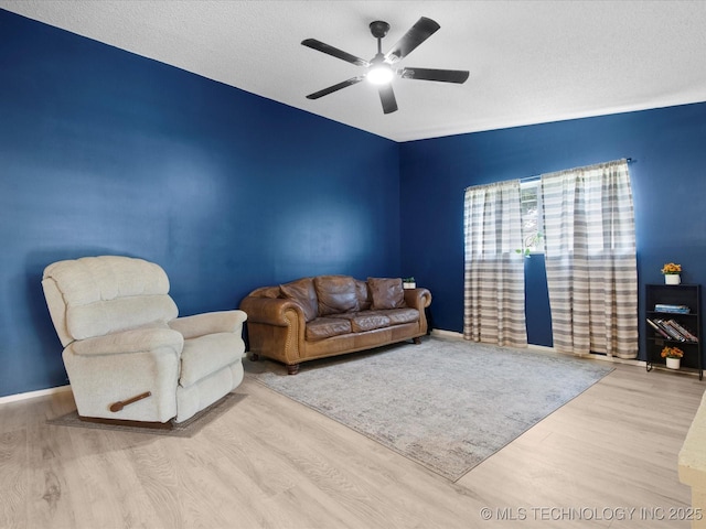 1267 Guinn Ln, Bartlesville, OK 74006 - living area with wood finished floors and ceiling fan