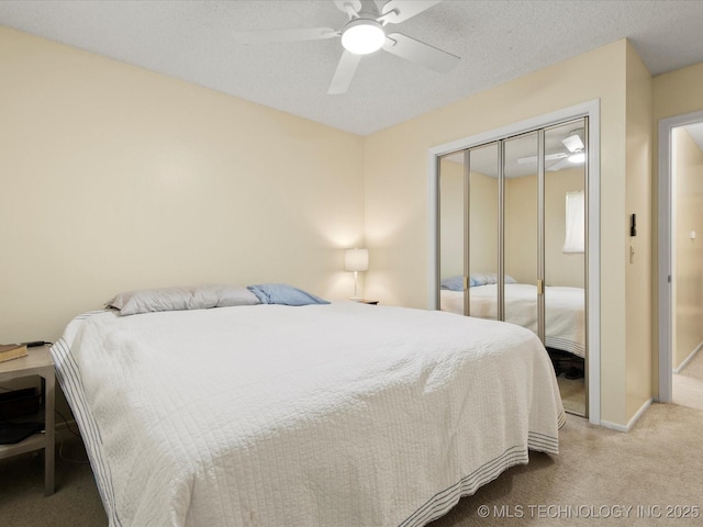 1267 Guinn Ln, Bartlesville, OK 74006 - carpeted bedroom featuring a closet and ceiling fan