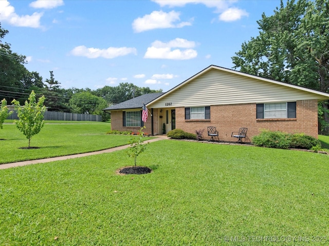 1267 Guinn Ln, Bartlesville, OK 74006 - ranch-style home featuring brick siding