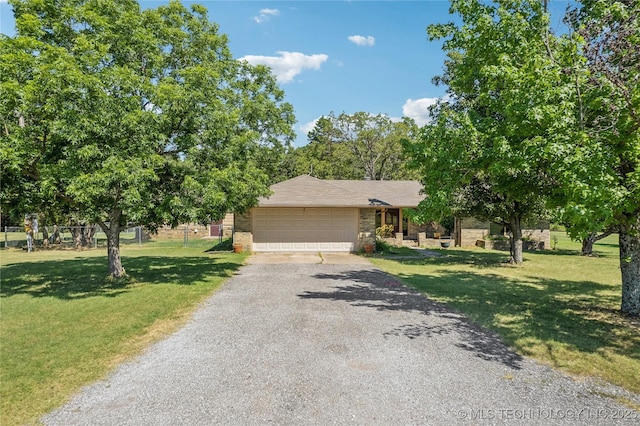 3609 E Scenic Dr, Cushing, OK 74023 - view of front of house featuring a front yard, brick siding, and driveway