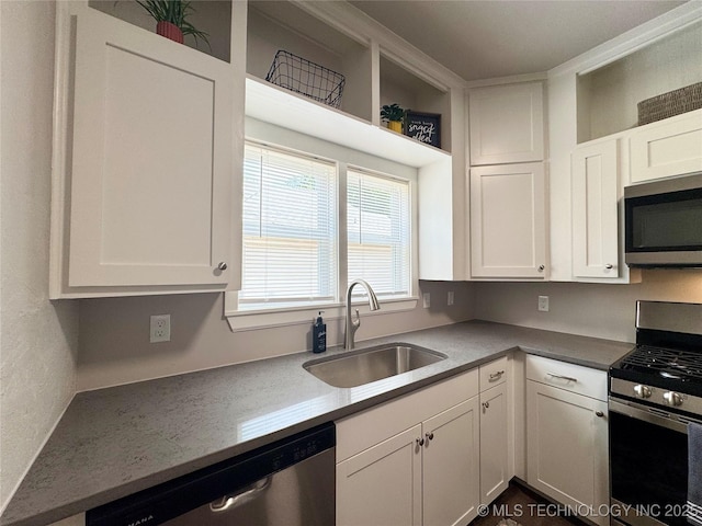 911 E Maple St, Cushing, OK 74023 - kitchen featuring stainless steel appliances and white cabinets