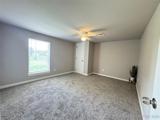 911 E Maple St, Cushing, OK 74023 - carpeted empty room with a ceiling fan and baseboards