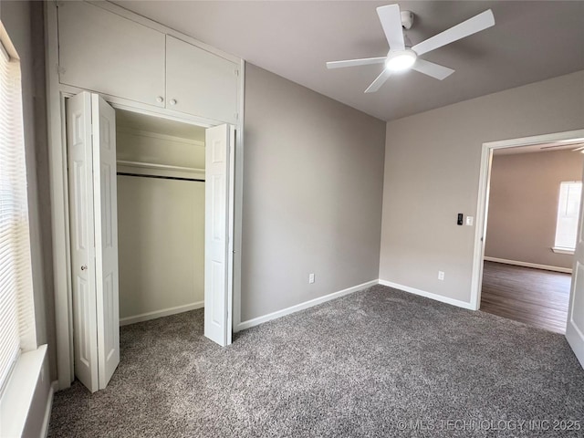 911 E Maple St, Cushing, OK 74023 - unfurnished bedroom featuring carpet, a closet, and a ceiling fan